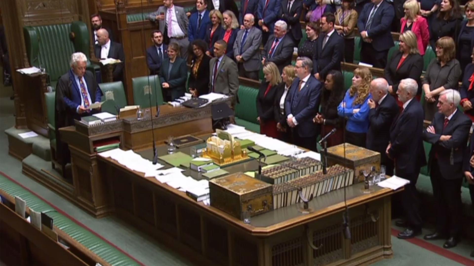 A video grab from footage broadcast by the UK Parliament's Parliamentary Recording Unit (PRU) shows Speaker of the House of Commons John Bercow (L) reading the address from the Queen that was just read by the Speaker of the House of Lords in the House of Commons in London on September 10, 2019, after the ceremony to prorogue (suspend) parliament. - The UK Parliament was prorogued, or suspended, until October 14, 2019. (Photo by HO / various sources / AFP) / RESTRICTED TO EDITORIAL USE - MANDATORY CREDIT " AFP PHOTO / PRU " - NO USE FOR ENTERTAINMENT, SATIRICAL, MARKETING OR ADVERTISING CAMPAIGNS - EDITORS NOTE THE IMAGE HAS BEEN DIGITALLY ALTERED AT SOURCE TO OBSCURE VISIBLE DOCUMENTS