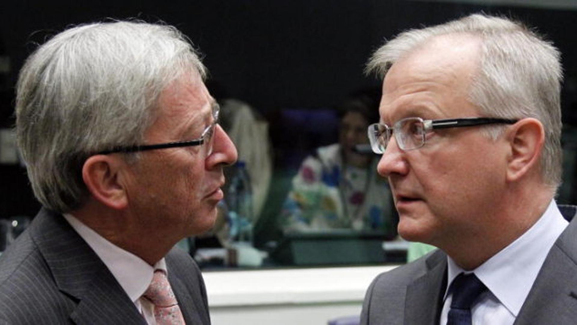 Jean-Claude Juncker en compagnie du commissaire européen aux Affaires monétaires, Olli Rehn