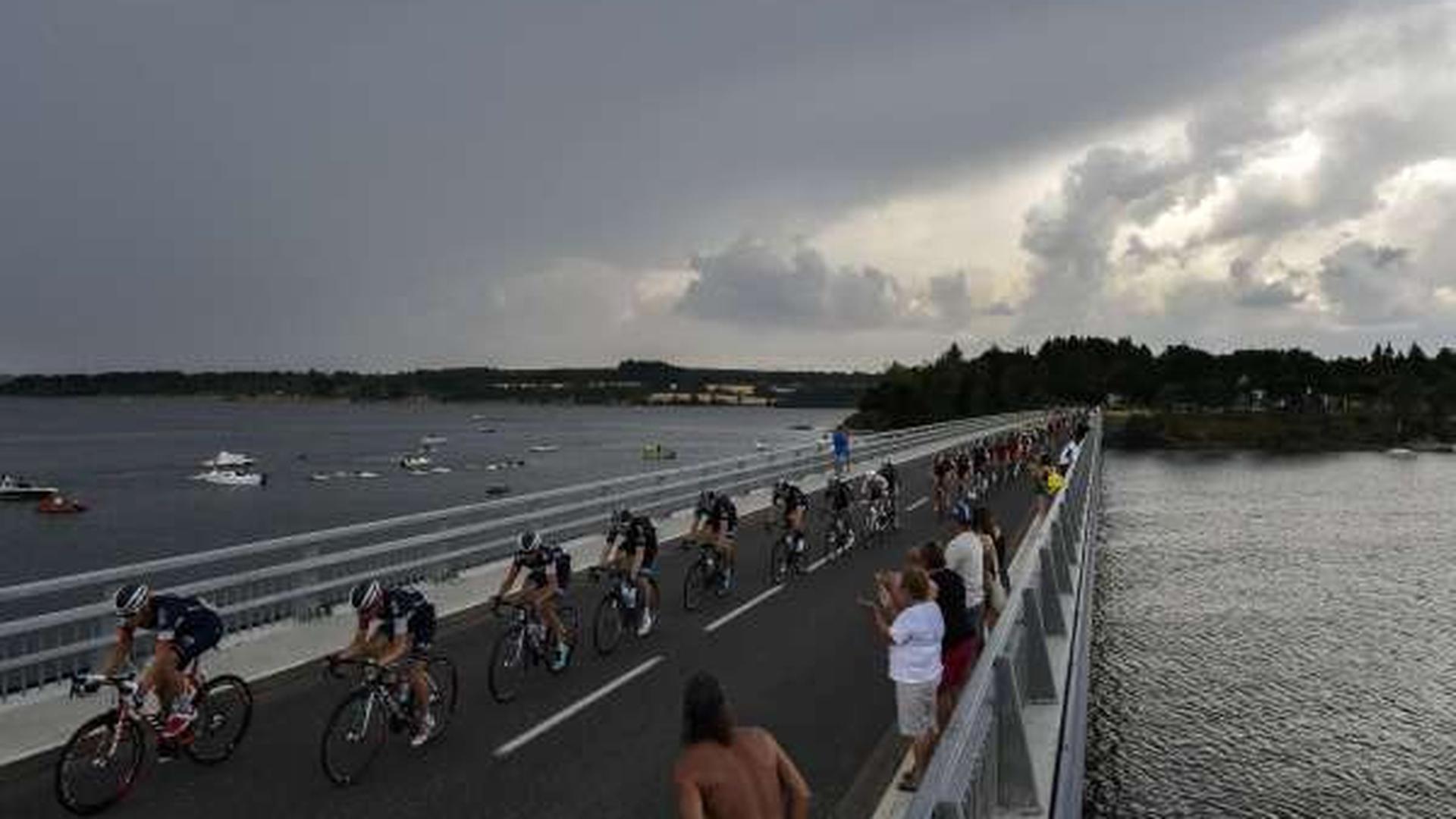 TOPSHOTS
The pack rides on a bridge during the 178,5 km fourteenth stage of the 102nd edition of the Tour de France cycling race on July 18, 2015, between Rodez and Mende, southern France.  AFP PHOTO / JEFF PACHOUD