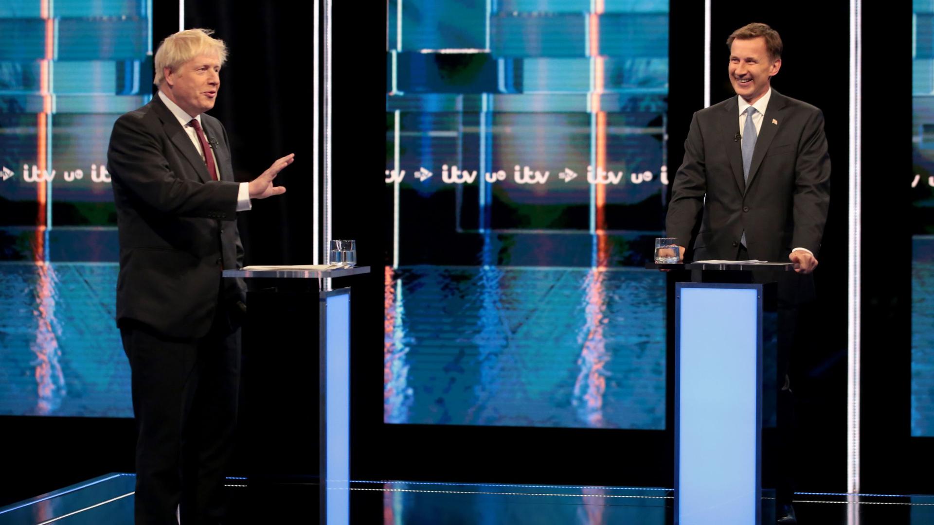 Conservative leadership contenders Boris Johnson and Foreign secretary Jeremy Hunt (R) take part in Britain's Next Prime Minister: The ITV Debate in Manchester on July 9, 2019. (Photo by Matt Frost / ITV / AFP) / RESTRICTED TO EDITORIAL USE - MANDATORY CREDIT "AFP PHOTO / ITV / MATT FROST " - NO MARKETING NO ADVERTISING CAMPAIGNS - DISTRIBUTED AS A SERVICE TO CLIENTS --- NO ARCHIVE ---
