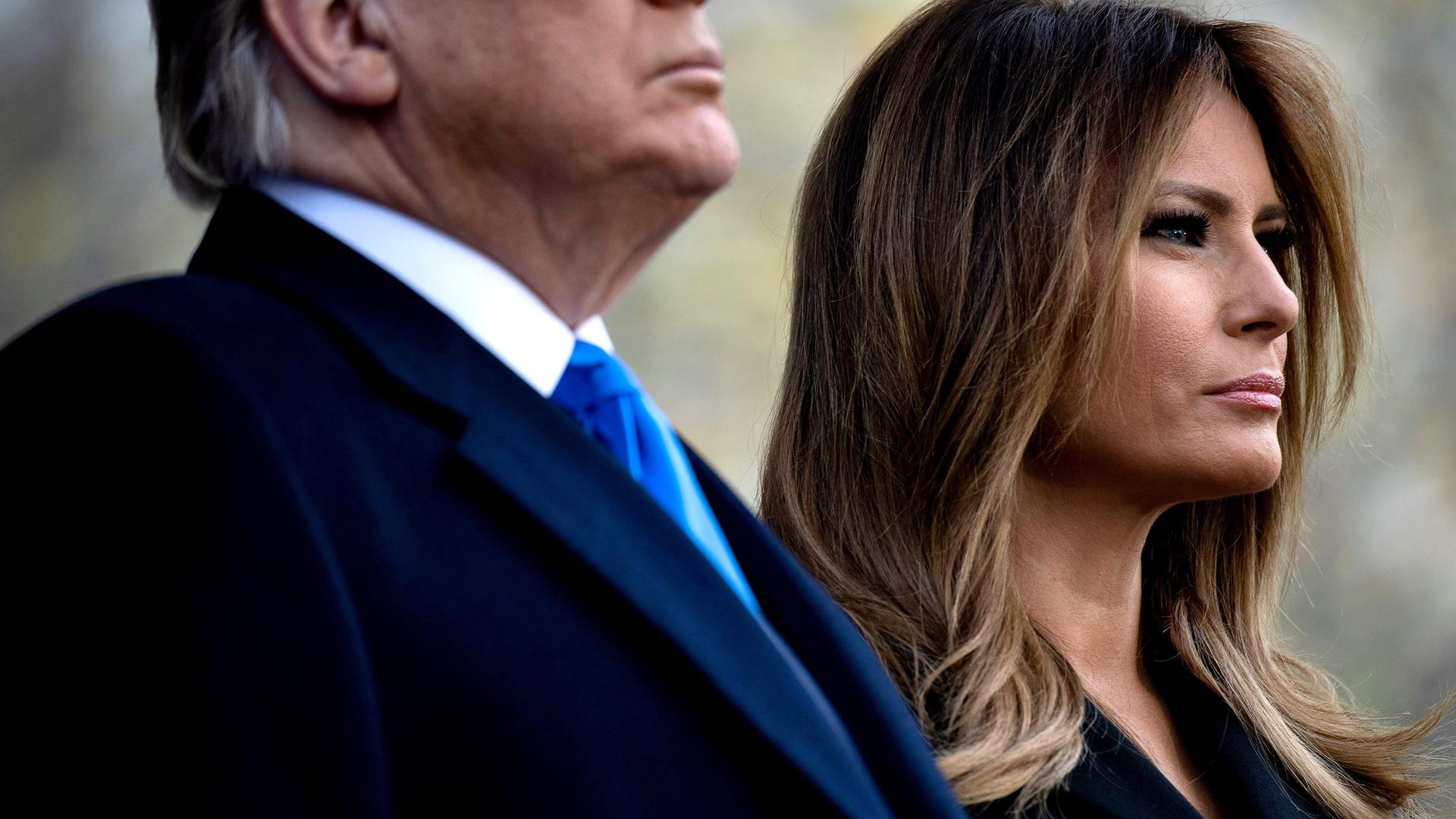 (FILES) In this file photo taken on November 11, 2019, US President Donald Trump and US First Lady Melania Trump listen to Taps during a Veterans Day event at Madison Square Park in New York. - Melania Trump on December 4, 2019, publicly rebuked Constitutional law professor Pamela Karlan,who used her 13-year-old son's name to make a point during an impeachment hearing against the president. Karlan invoked Barron Trump to demonstrate how the Constitution imposes distinctions between a monarch's power and that of a president. "The constitution says there can be no titles of nobility," Karlan told lawmakers, "So while the president can name his son 'Barron', he can't make him a baron." The pun led to chuckles in the congressional hearing room, but Melania Trump made clear it was no laughing matter. (Photo by Brendan Smialowski / AFP)