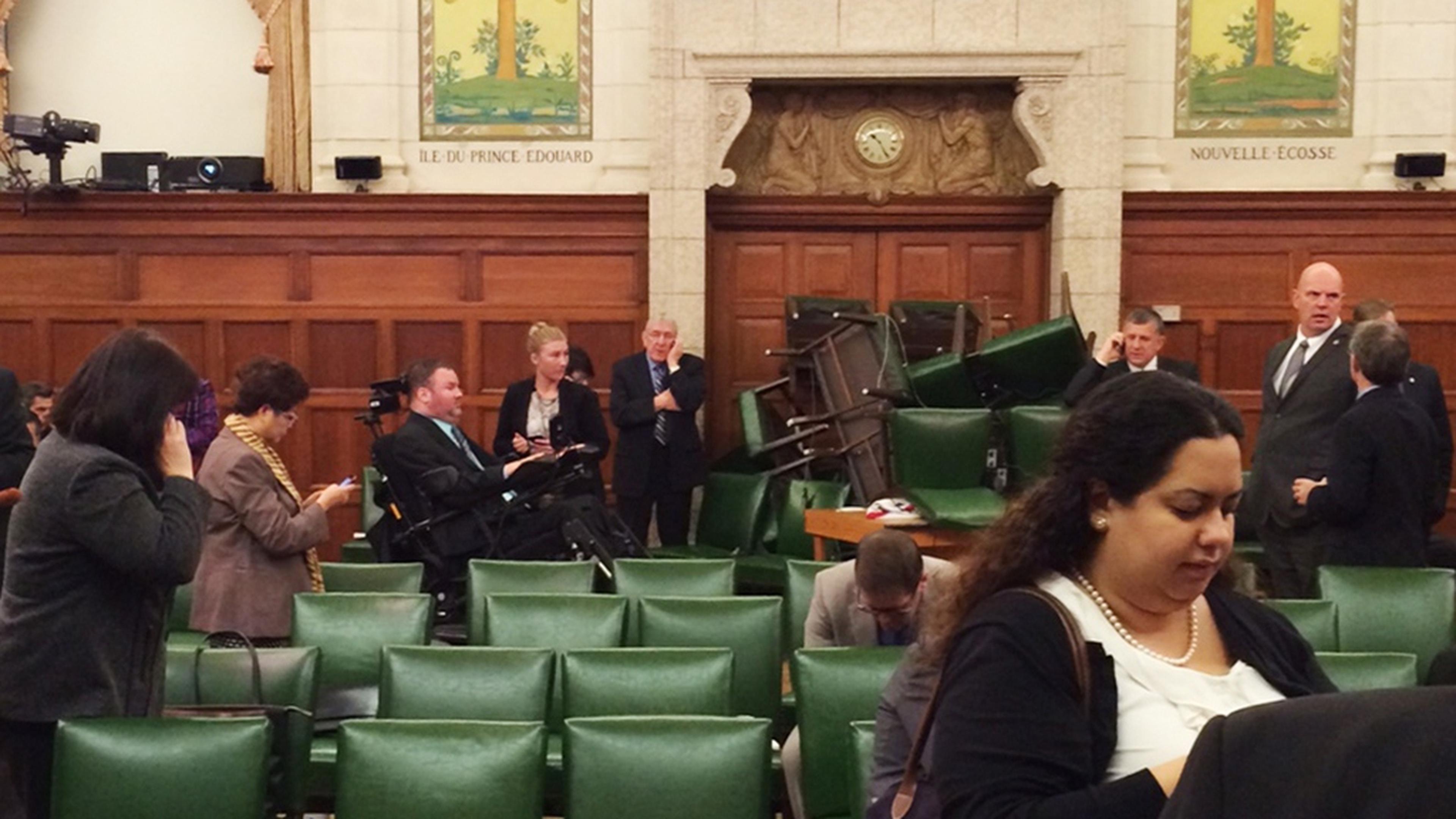 The Conservative Party caucus room is shown shortly after shooting began on Parliament Hill, in Ottawa, Ontario, October 22, 2014, taken and provided by MP Nina Grewal. Ottawa police are looking for multiple suspects in the shooting incidents on Wednesday near the Canadian war memorial and nearby Parliament Hill, a spokesman said. REUTERS/MP Nina Grewal/Handout  (CANADA - Tags: POLITICS CRIME LAW CIVIL UNREST) FOR EDITORIAL USE ONLY. NOT FOR SALE FOR MARKETING OR ADVERTISING CAMPAIGNS. THIS IMAGE HAS BEEN SUPPLIED BY A THIRD PARTY. IT IS DISTRIBUTED, EXACTLY AS RECEIVED BY REUTERS, AS A SERVICE TO CLIENTS