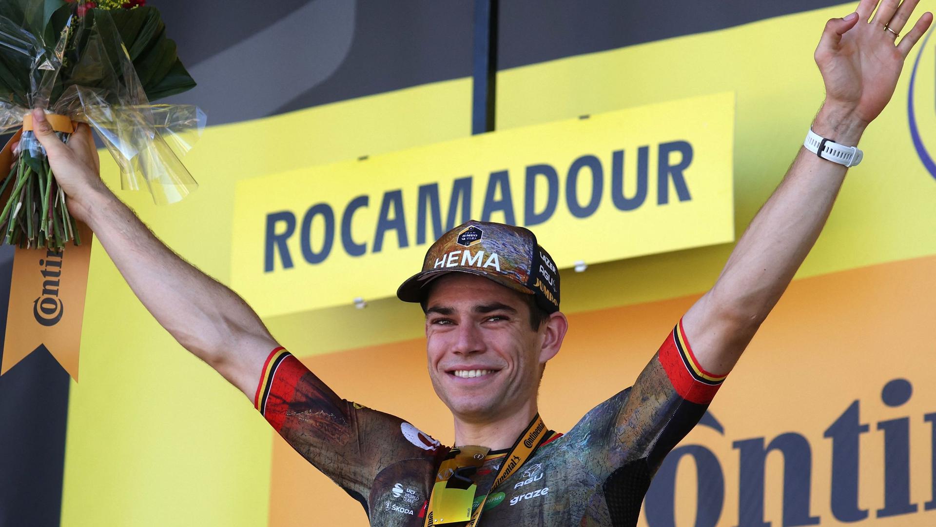 Jumbo-Visma team's Belgian rider Wout Van Aert celebrates his victory on the podium after winning the 20th stage of the 109th edition of the Tour de France cycling race, 40,7 km individual time trial between Lacapelle-Marival and Rocamadour, in southwestern France, on July 23, 2022. (Photo by Thomas SAMSON / AFP)
