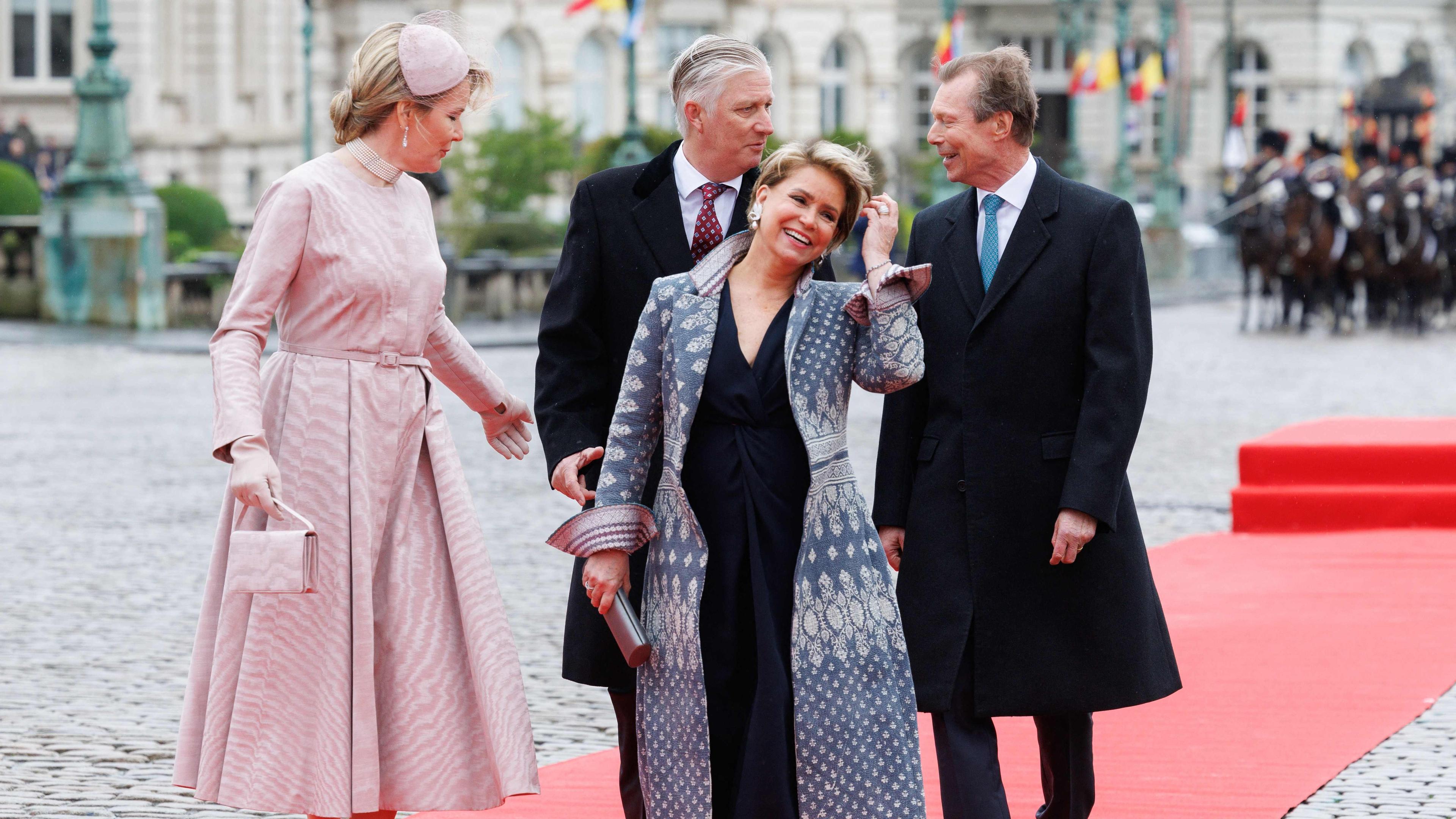 (FROM L) Queen Mathilde of Belgium, King Philippe - Filip of Belgium, Grand Duchess Maria Teresa of Luxembourg and Grand Duke Henri of Luxembourg walk during the official welcome ceremony at the Royal Palace, on the first day of the official state visit of the Luxembourg royal couple to Belgium, in Brussels on April 16, 2024. (Photo by BENOIT DOPPAGNE / Belga / AFP) / Belgium OUT