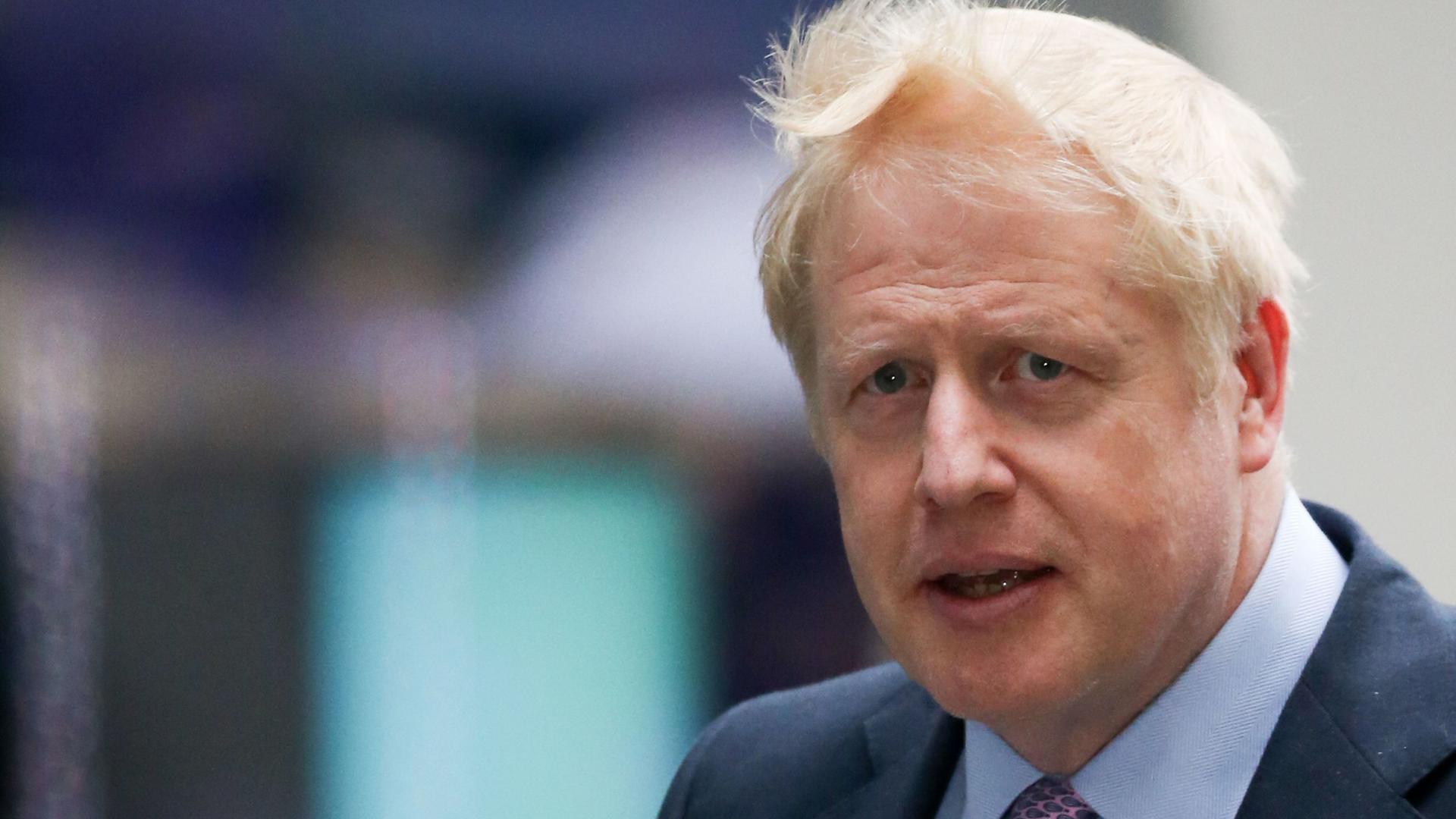 Conservative MP Boris Johnson arrives at the BBC studios in London on June 18, 2019 to take part in the Conservative Party leadership BBC television debate. - The UK leadership race narrowed to five on June 18 as Brexit figurehead Boris Johnson prepared to defend his runaway favourite status in his first television debate. (Photo by ISABEL INFANTES / AFP)